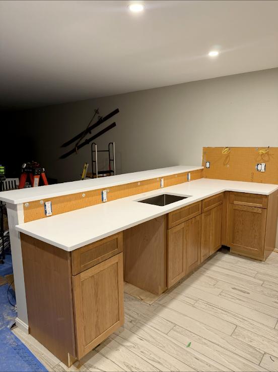 New wet bar cabinets and countertop, mid-installation