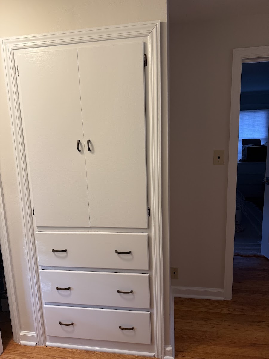 Built-in closet cabinet freshly painted white
